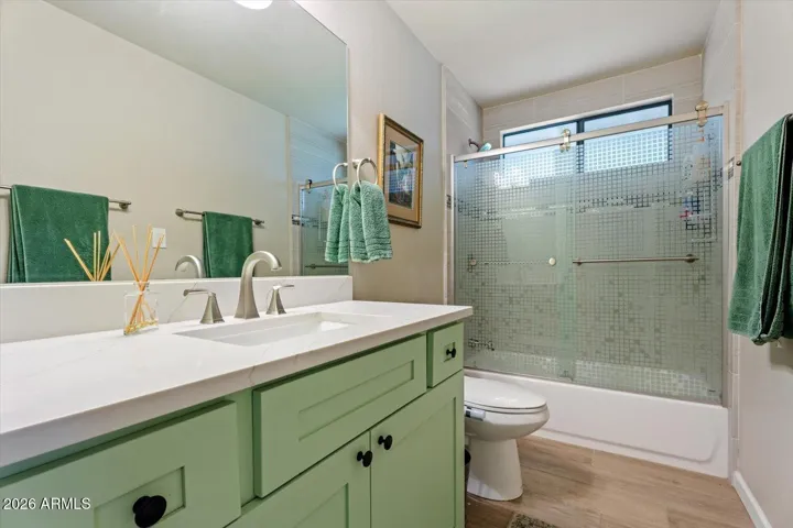 Guest bathroom with full shower.
