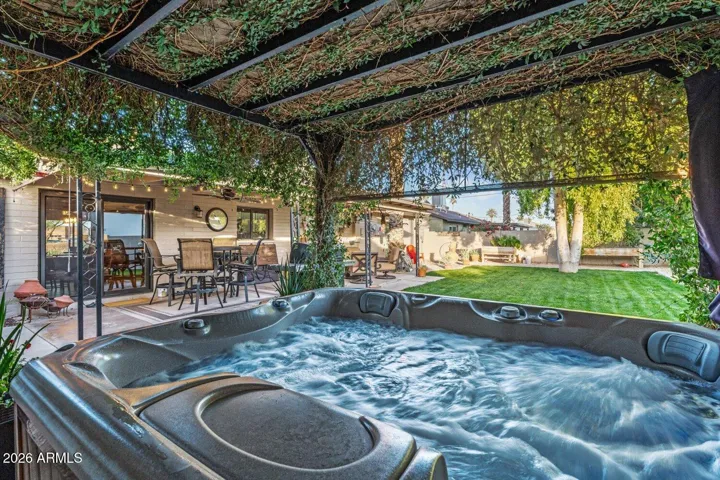 Spa and pergola provide an enchanting space to relax.