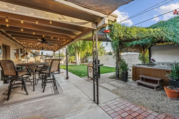 Backyard of your dreams, with covered patio, fun lighting, misters for the hotter months and so much more.