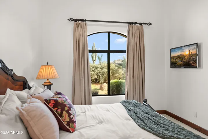 Captivating desert and saguaro views visible from Guest Bedroom 2, showcasing the home’s connection to its surroundings
