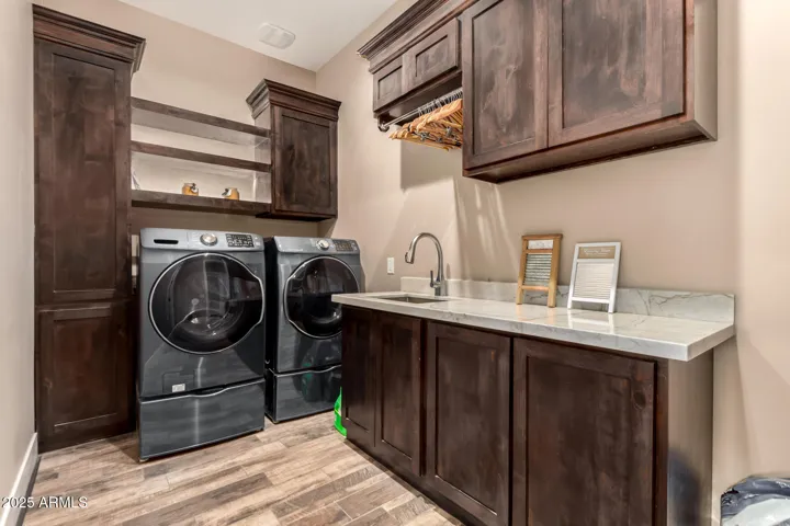 Laundry room conveniently located next to master bedroom closet