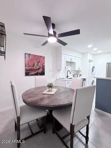 Inviting dining room with kitchen light and bright!