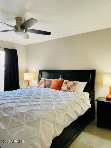 Bedroom 1 with comfy King with full storage base to unpack and unwind and convenient end tables ,cooling fan and black out drapes for day sleepers if needed! Huge Walk in Closet!