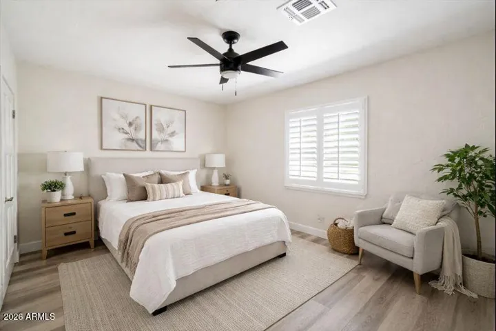 Bedroom 1. This imaged is virtually staged.
