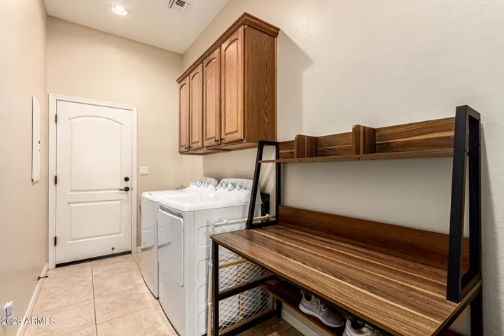 Laundry room with ample cabinets!