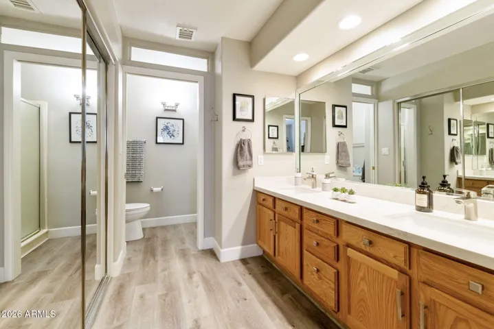 EXPANSIVE PRIMARY BATH WITH MIRRORED WALK IN CLOSET AND DUAL VANITIES