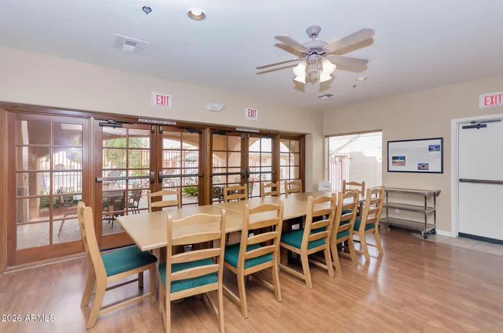 BANQUET SEATING INSIDE OR OUT ON COMMUNIT PAIO WITH A POOL VIEW