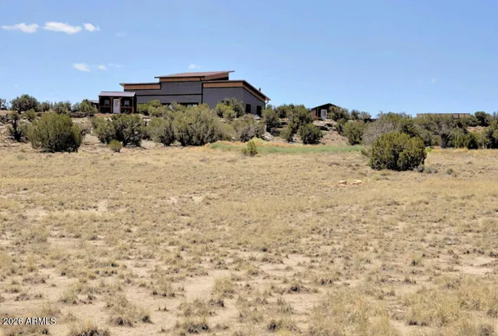 This Thoroughly Modern Home Sits Regally Atop its Lushly Treed Scenic Ridge