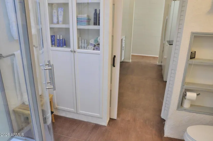 Second Bathrm Features Pass-Through Doors for Convenient Access from Either Side of the House