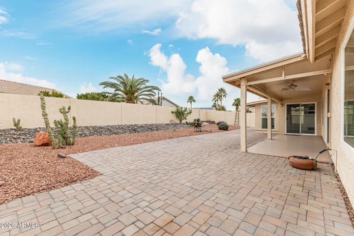 Maintenance free back yard with covered patio and pavers. Side gate wide enough to fit a golf cart through!