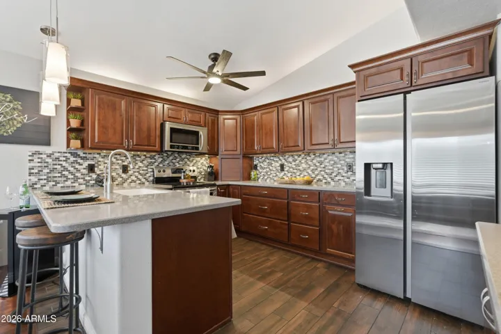 Under-cabinet lighting, soft-close doors and drawers, roll-out shelving, pull-out trash/recycling