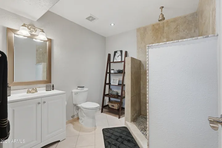 Upgraded vanity, mirror, and light fixture