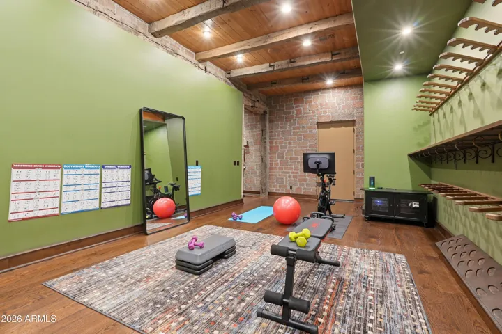 Ideal for golf simulator! Hickory floors, beamed ceiling, stone wall, collector's racks