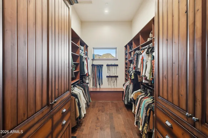 Walk-in closet, custom Alder cabinetry, storage bench