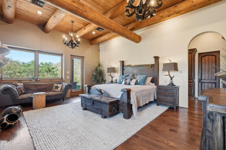 Beamed ceiling, hickory floors, arch entry to ensuite