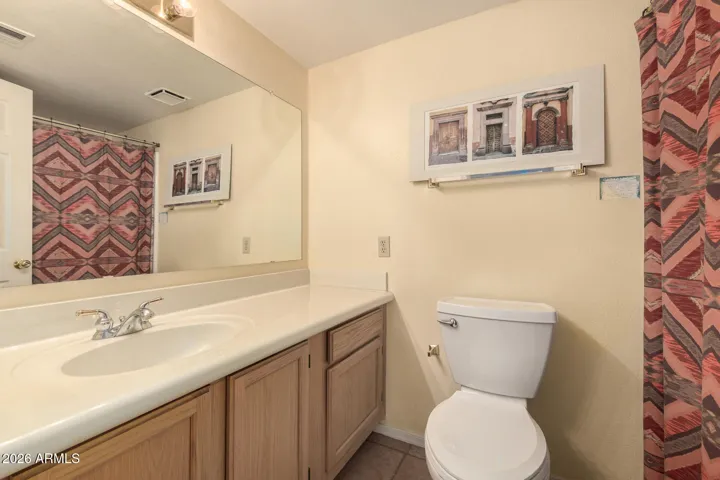 has a large vanity & tub/shower combo.