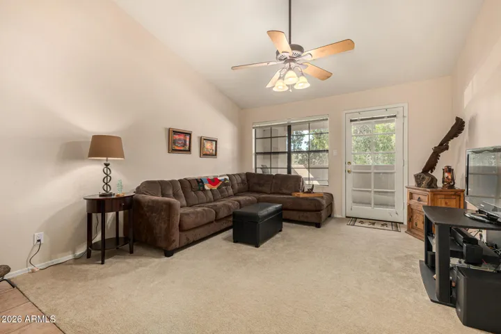 is spacious and has doors to the patio.
