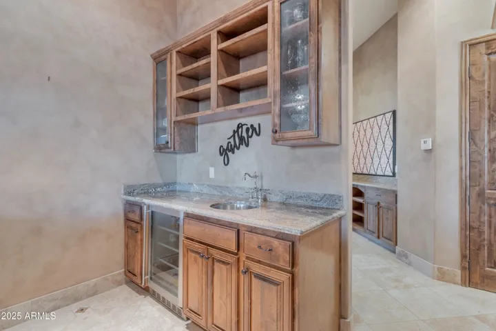 Inside the Entertainment Bar, sink and wine cooler/fridge