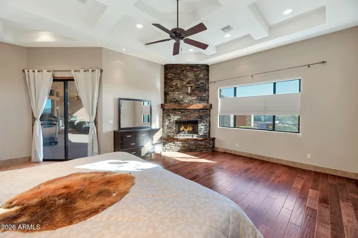 Large Primary suite, fireplace, with sliders to patio/pool.