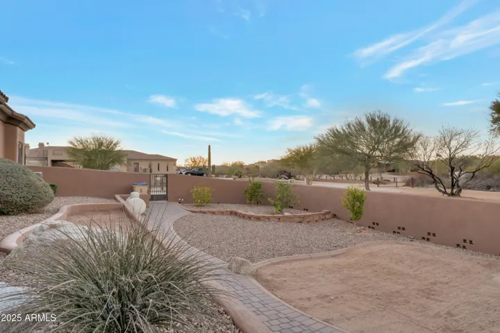 Walled area accessible from pool or front driveway, 4 fruit trees