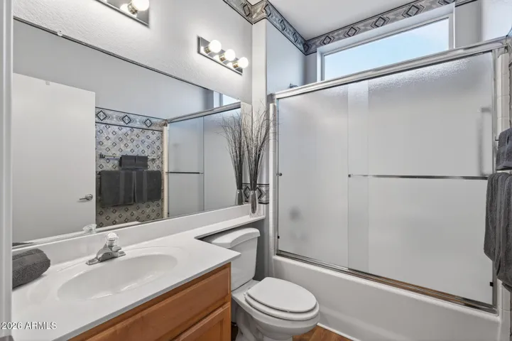 The hall bath is light & bright for guests.
