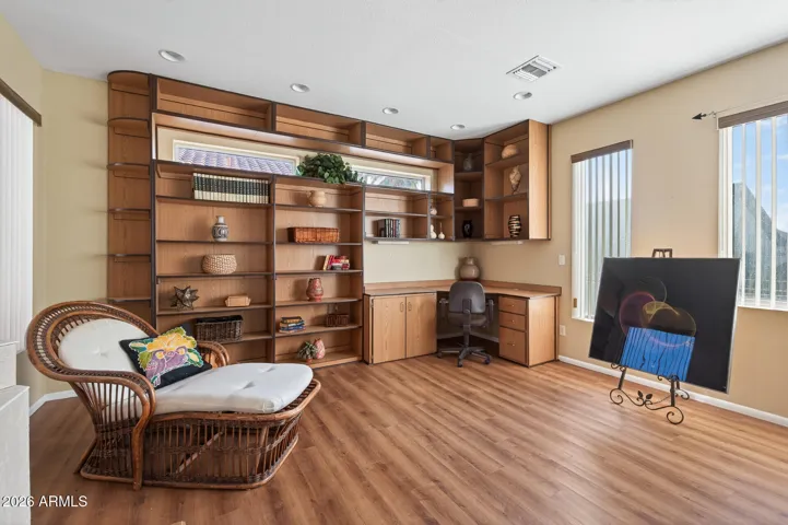 Notice all the storage and shelves in the room addition office area.