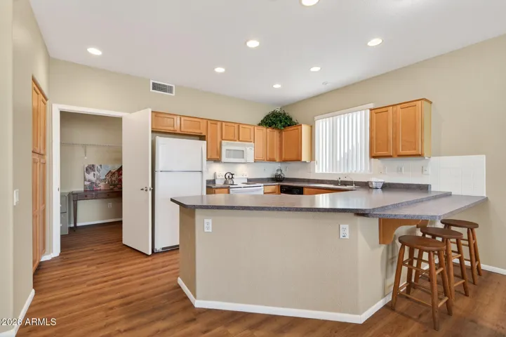 Look at all of the counter space and breakfast bar.