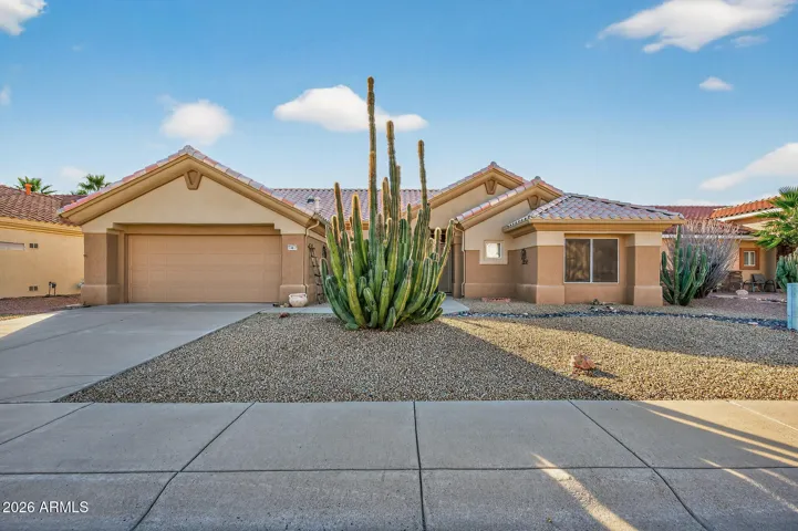 Enjoy AZ living in this lovely home with a room addition off the kitchen.