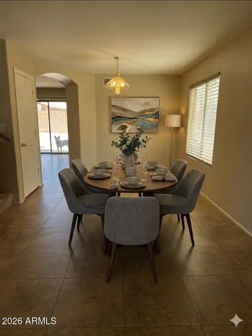 Dedicated formal dining room with great flow - Photos may include AI-generated or enhanced elements; actual property may differ