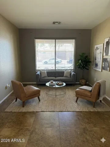 Formal living space with open, inviting layout - Photos may include AI-generated or enhanced elements; actual property may differ