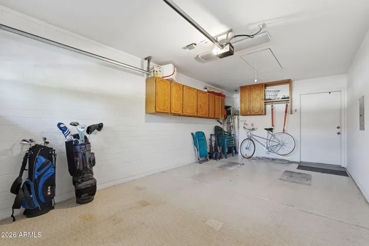 The water heater is set back in it's own space providing more room for car, bikes, golf clubs.