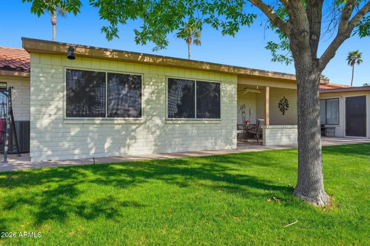 South back of condo with a bonus of a tree to shade you during those hot summer months.