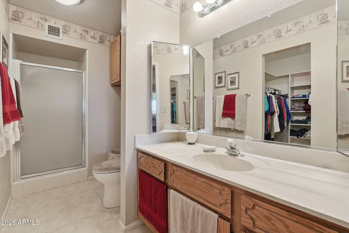 Primary Bathroom with shower and walk-in closet to the left.