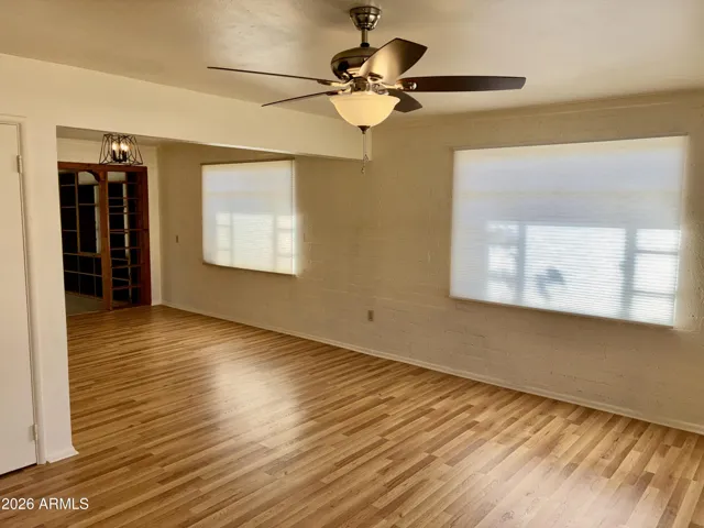 New Ceiling Fan, Vinyl Plank Flooring and fresh paint in the Formal Living. Room