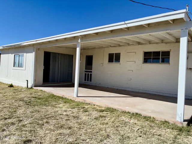 Covered Back Porch adjacent to both the Kitchen Back Door and the Private F Room.