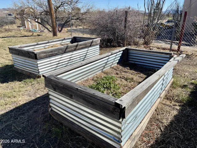 Raised Gardening Beds for Fresh Vegetables or Colorful Flowers located in the Back Yard.