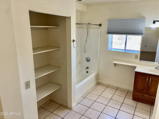 M Bathroom features Ample Linen Storage, a shower/bath, sink, and a private Water Closet. Access to the Laundry Room is through the M Bathroom.