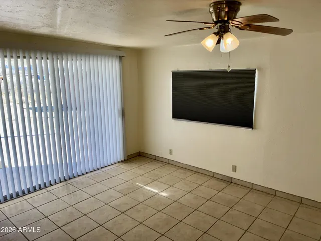 Private F Room has a Sliding Glass Entry Door from the back yard area, and has a New Ceiling Fan.