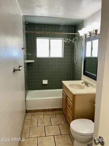 Guest Bathroom located in the hallway for easy access from Bedroom #1 and Bedroom #2, as well as for guests.