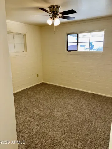 Bedroom #2 features a New Ceiling Fan, New Carpeting, Fresh Paint, and a Petite Walk-In Closet.