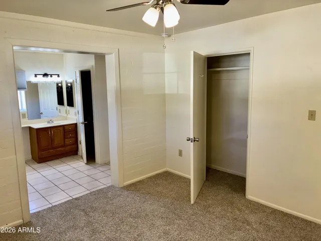 M Bedroom features New Carpeting, Fresh Paint, a New Ceiling Fan, a Walk-In Closet, and direct access to a Private M Bathroom and Laundry Room.