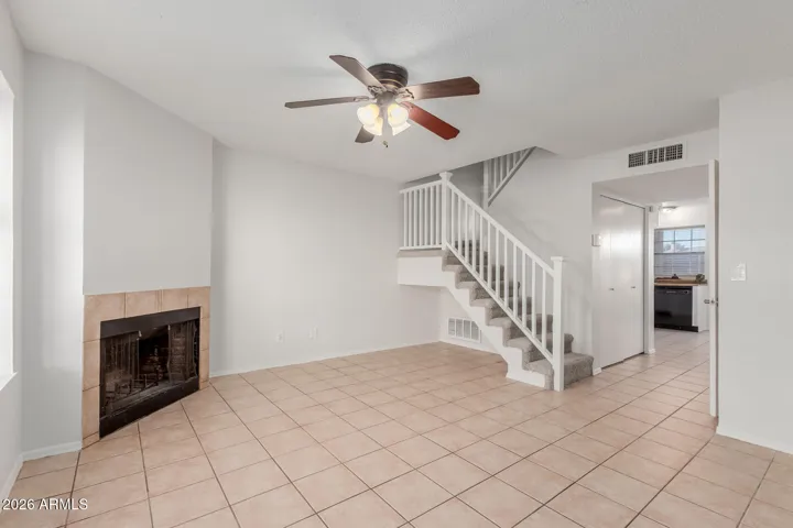 Living room with fireplace - view to laundry & kitchen