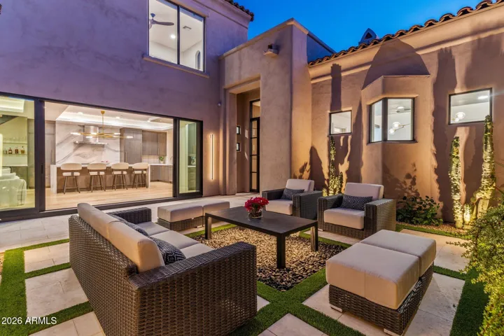 Private courtyard with soft lighting creating a true indoor/outdoor feel.