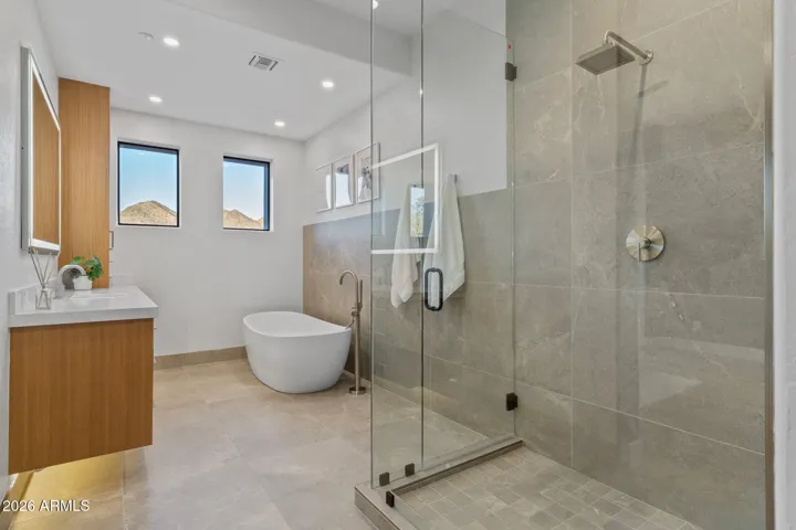 Junior suite bath with large lighted makeup mirror