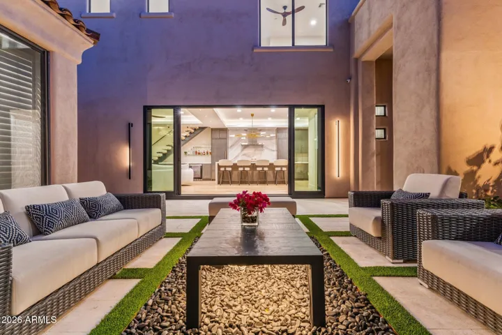 Private courtyard with soft lighting creating a true indoor/outdoor feel.