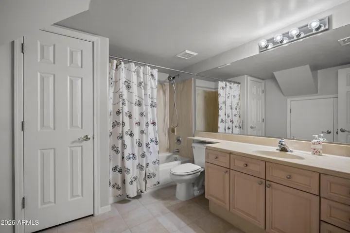 Large full bathroom in the basement with a linen closet and room to add an additional sink if desired!