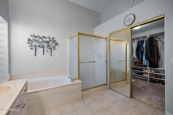 Walk-in shower and separate Roman soaking tub ....