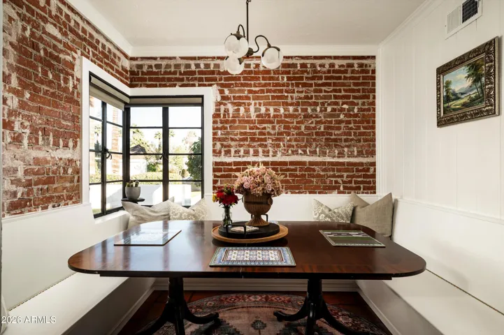 Morning rituals unfold within the warmth of brick and natural light.