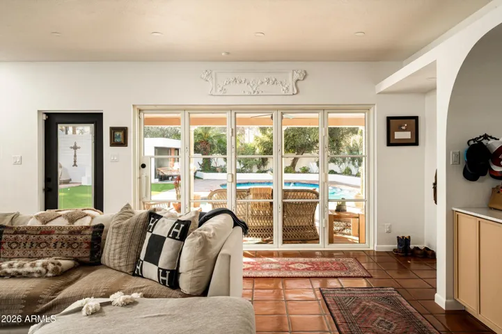 An open passage connecting gathering space to sunlit patio moments