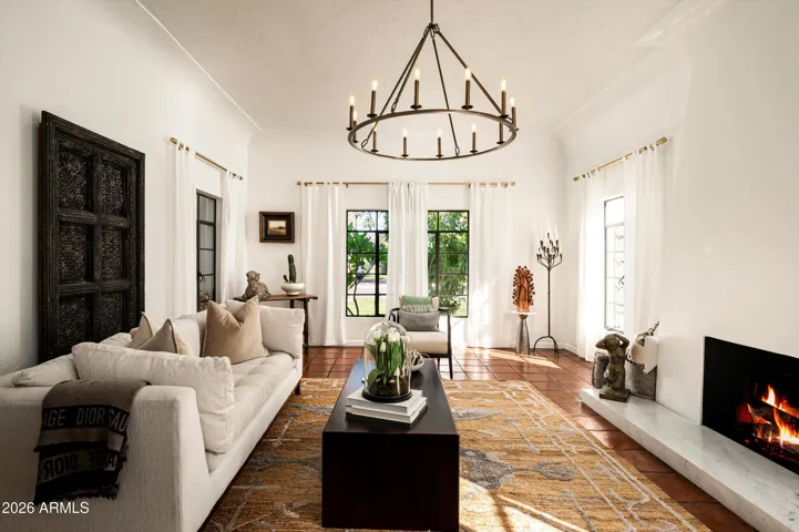 A warm gathering space anchored by fire, texture, and timeless Spanish character